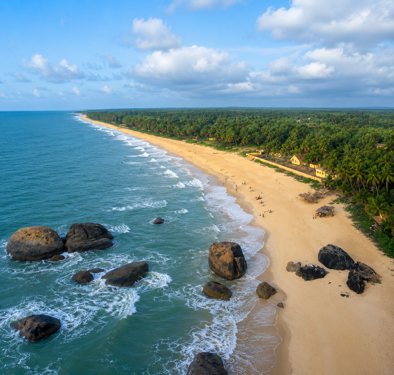Scenic Coastal Karnataka beach with golden sand, palm trees, and Arabian Sea