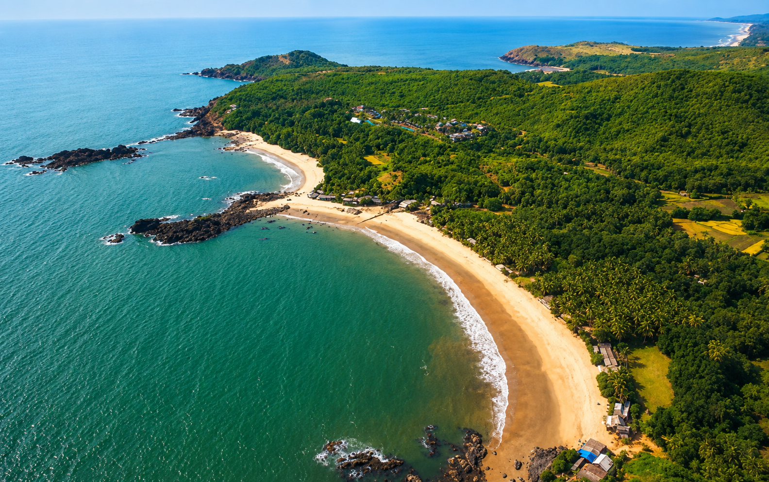 Aerial view of Om Beach in Gokarna with golden sand and Arabian Sea coastline